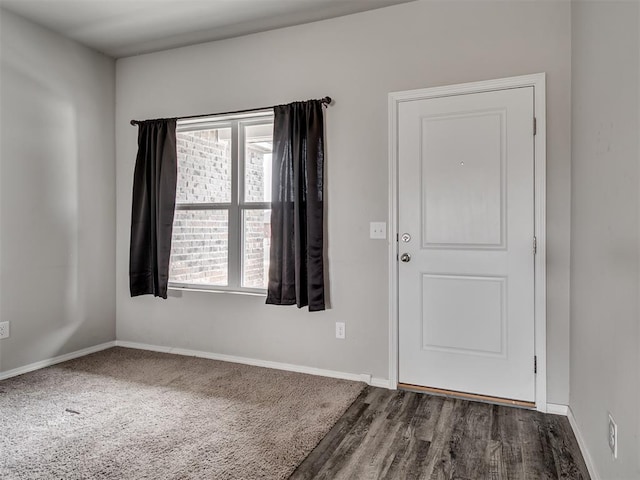 foyer with a wealth of natural light and wood-type flooring