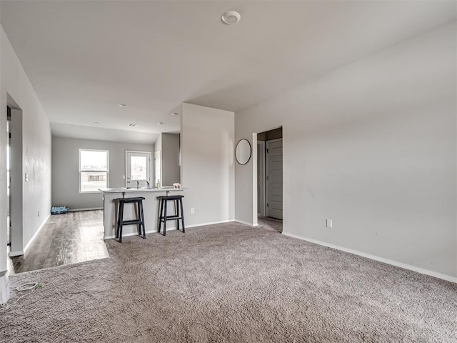 unfurnished living room with carpet
