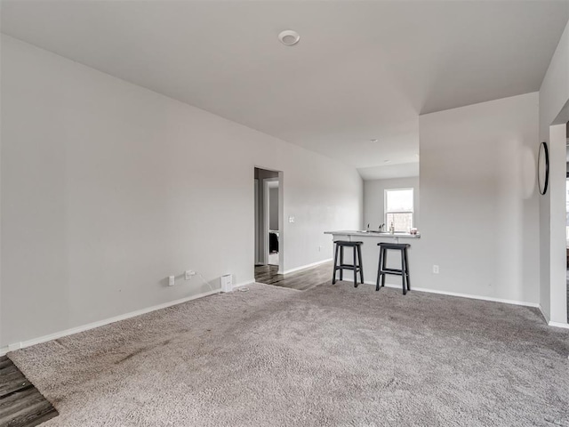 empty room featuring dark carpet