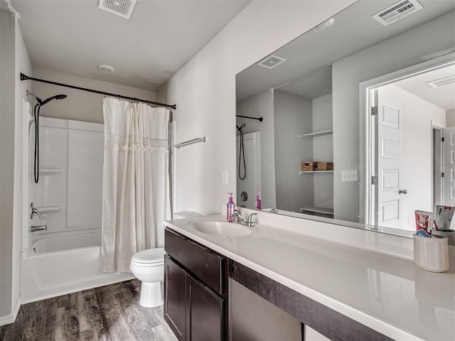 full bathroom featuring hardwood / wood-style flooring, vanity, toilet, and shower / bath combination with curtain