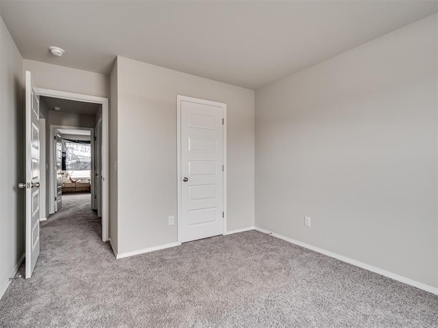unfurnished bedroom featuring light colored carpet