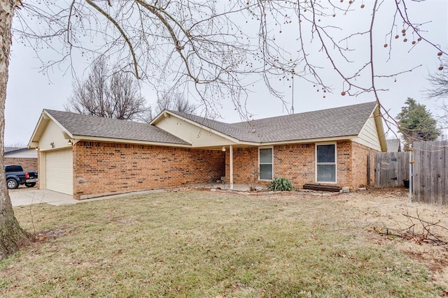 ranch-style home with a garage and a front lawn