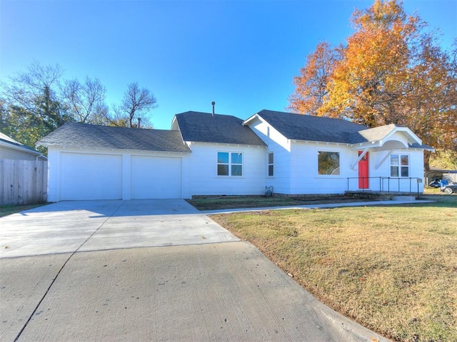 view of front of property featuring a garage and a front yard