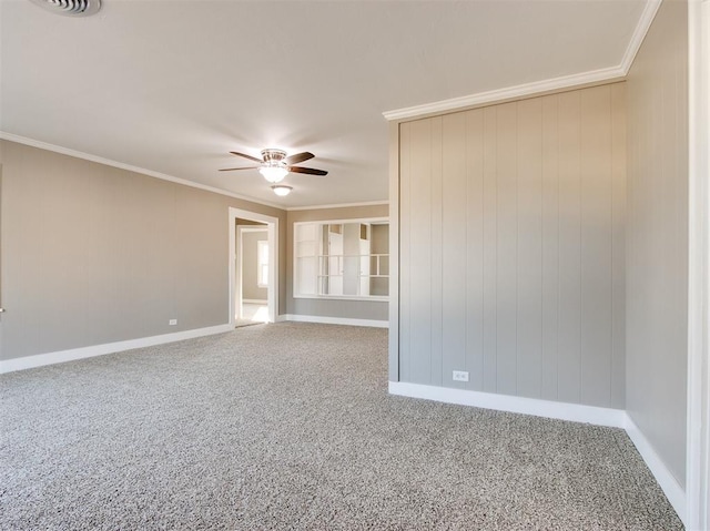 carpeted empty room with ornamental molding and ceiling fan