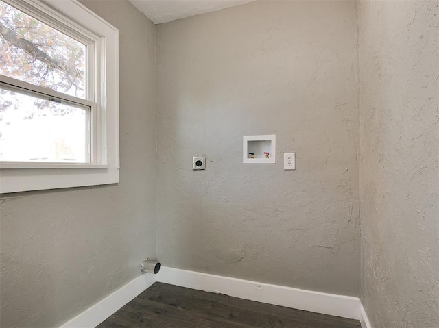 clothes washing area featuring electric dryer hookup, hookup for a washing machine, and dark hardwood / wood-style flooring