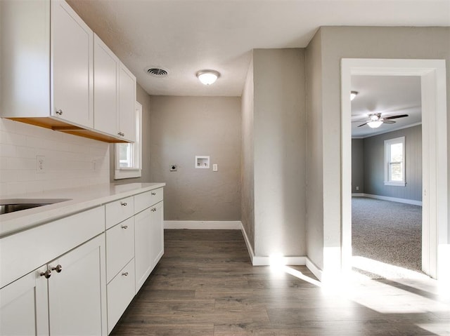 kitchen with white cabinetry, backsplash, dark hardwood / wood-style floors, and ceiling fan