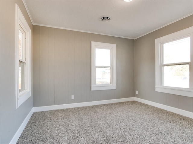 carpeted empty room with crown molding