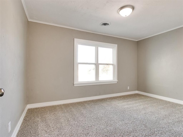 carpeted spare room featuring ornamental molding