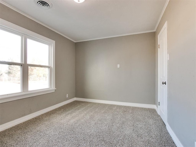 empty room featuring ornamental molding and carpet floors