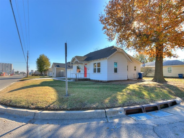 ranch-style home with a front lawn