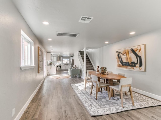 dining room with light hardwood / wood-style floors