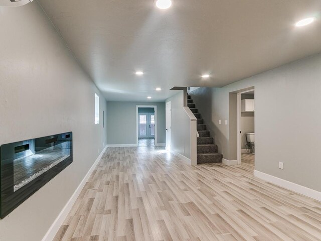 unfurnished living room with light hardwood / wood-style flooring