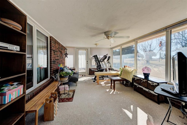 sunroom with a ceiling fan