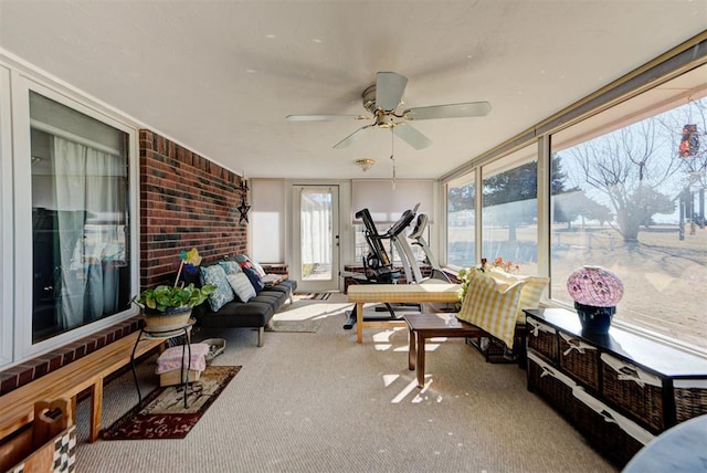 sunroom / solarium featuring ceiling fan