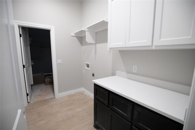 3105 Feather Dr, Yukon, OK 73099 - laundry area with hookup for a washing machine, cabinet space, hookup for an electric dryer, and light wood-type flooring