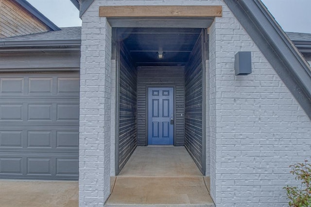 property entrance with a garage