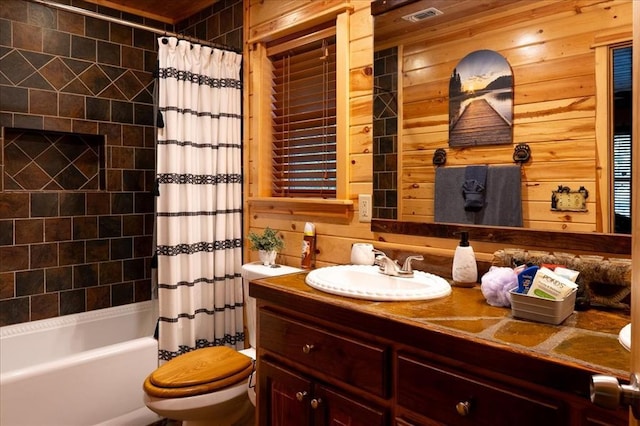 full bathroom with vanity, shower / tub combo, wood walls, and toilet