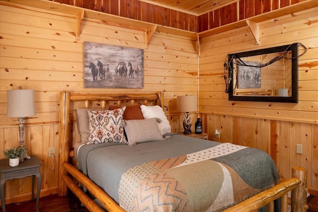 bedroom with wood walls