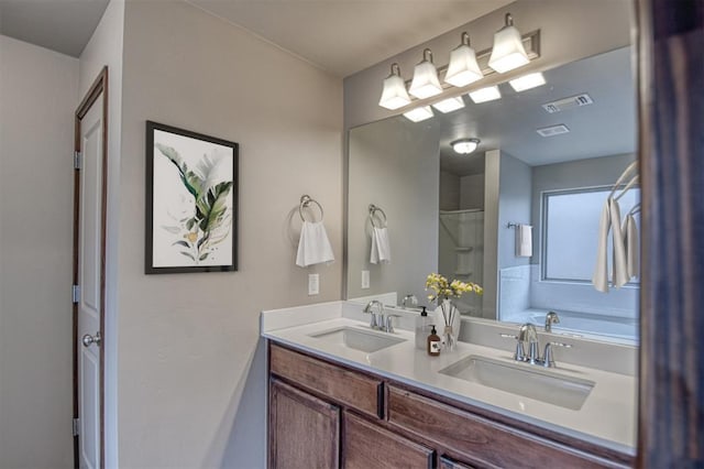 bathroom with a bathing tub and vanity