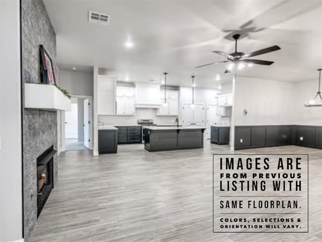 interior space featuring ceiling fan and light hardwood / wood-style floors