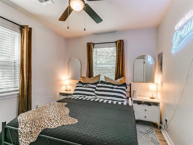 bedroom featuring ceiling fan and light hardwood / wood-style floors