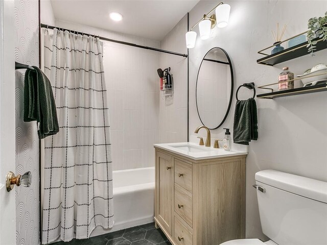 full bathroom with tile patterned flooring, vanity, toilet, and shower / bath combo with shower curtain