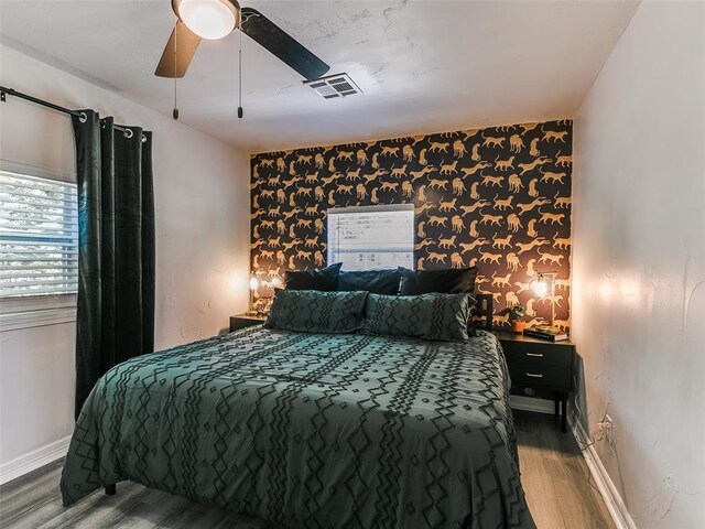 bedroom featuring hardwood / wood-style flooring and ceiling fan