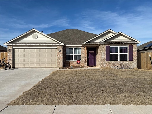 view of front of property with a garage and a front lawn