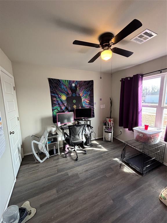 office with dark hardwood / wood-style flooring and ceiling fan