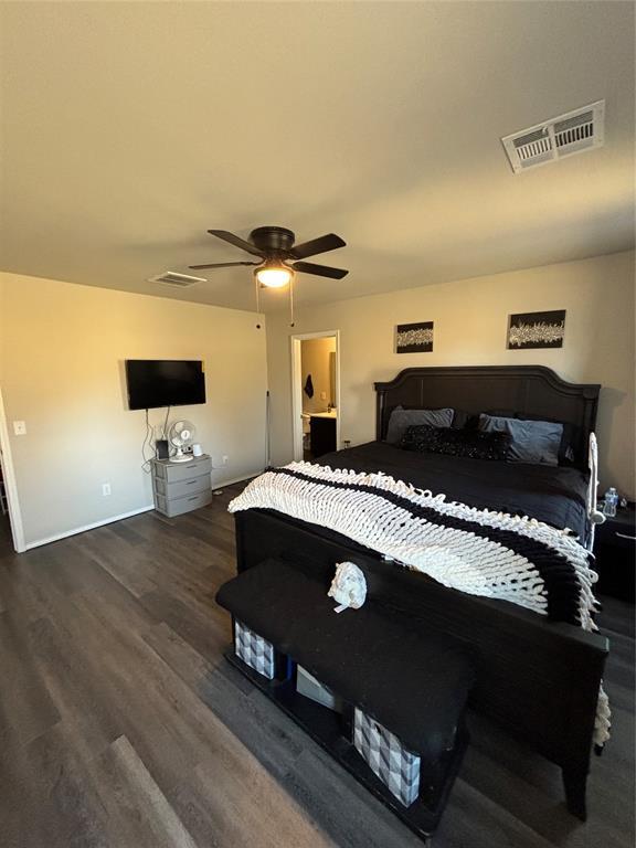 bedroom with ceiling fan and dark hardwood / wood-style flooring