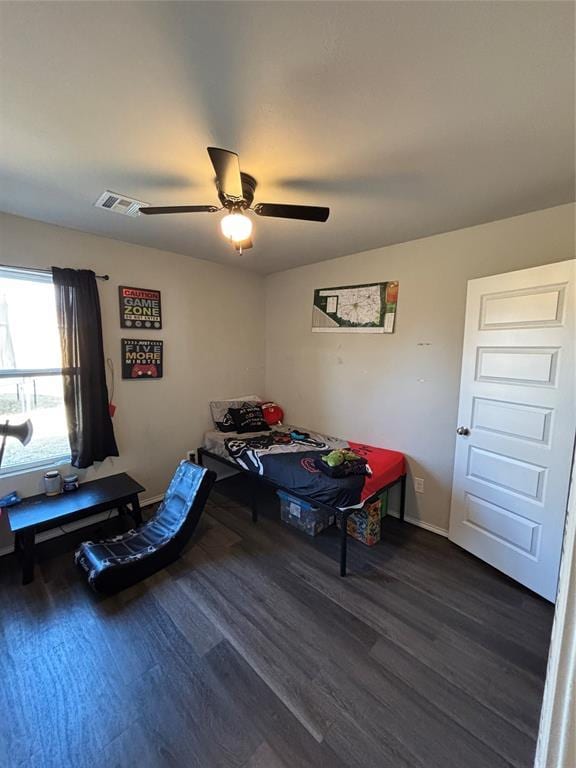 bedroom featuring dark hardwood / wood-style floors and ceiling fan