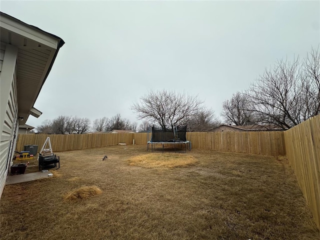 view of yard featuring a trampoline