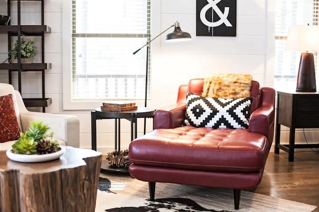 living area featuring a healthy amount of sunlight and hardwood / wood-style floors