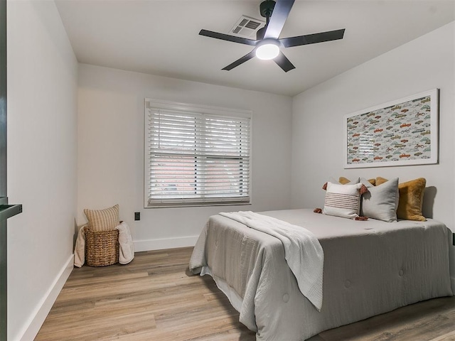 bedroom featuring ceiling fan and light hardwood / wood-style floors