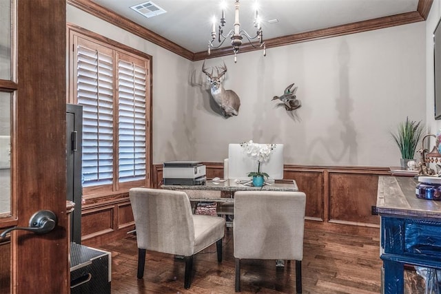 dining area featuring a notable chandelier, ornamental molding, and dark hardwood / wood-style floors