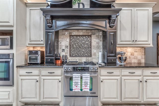 kitchen with white cabinetry, decorative backsplash, and stainless steel appliances