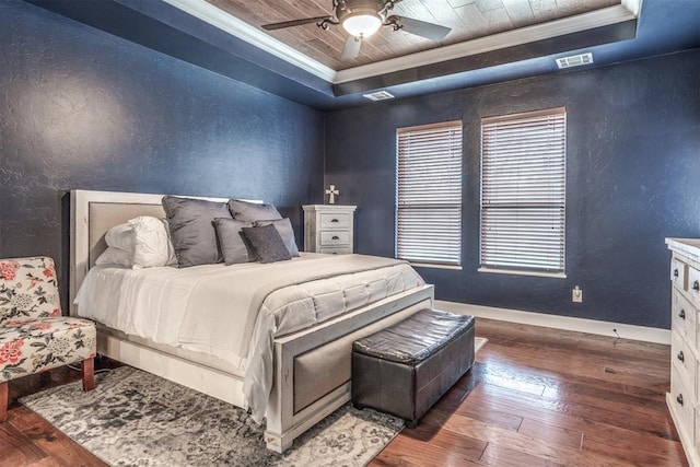 bedroom featuring ornamental molding, dark hardwood / wood-style flooring, a raised ceiling, and wooden ceiling