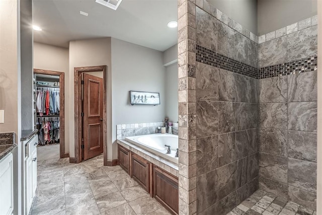 bathroom featuring vanity and a bathtub