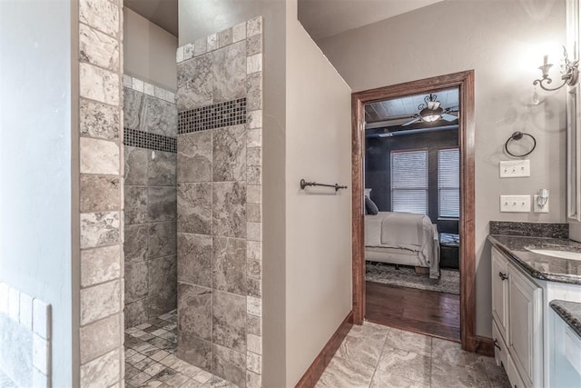 bathroom with vanity and tiled shower