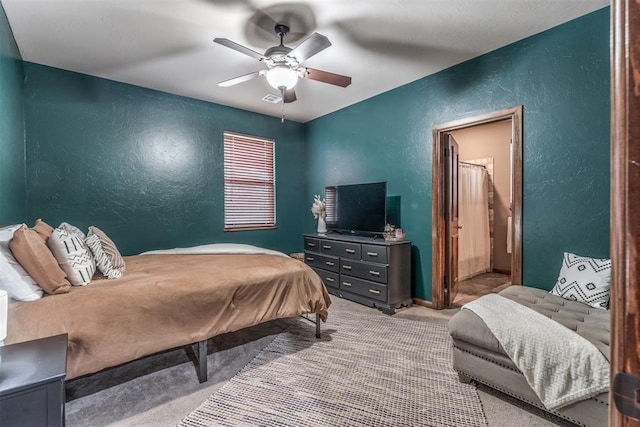 carpeted bedroom featuring ceiling fan