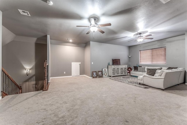 carpeted living room featuring ceiling fan