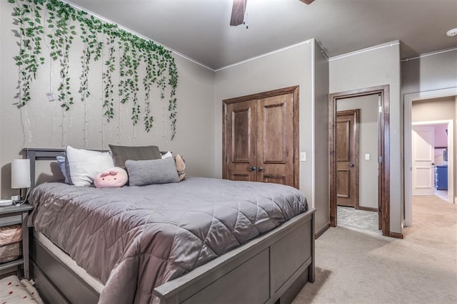 bedroom with ceiling fan and light colored carpet