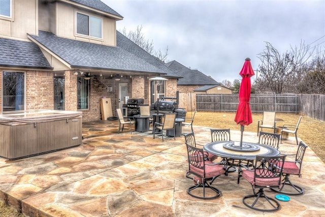 view of patio / terrace featuring area for grilling and a hot tub