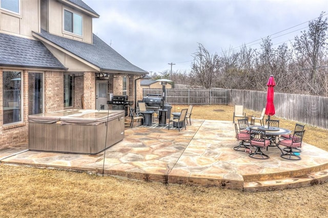 view of patio featuring a hot tub and grilling area