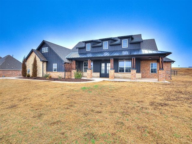 view of front of home with a front lawn and covered porch