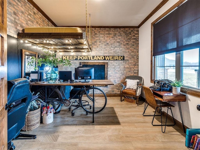 office featuring hardwood / wood-style flooring, ornamental molding, and brick wall