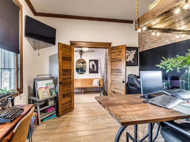 office area featuring ornamental molding and light hardwood / wood-style floors