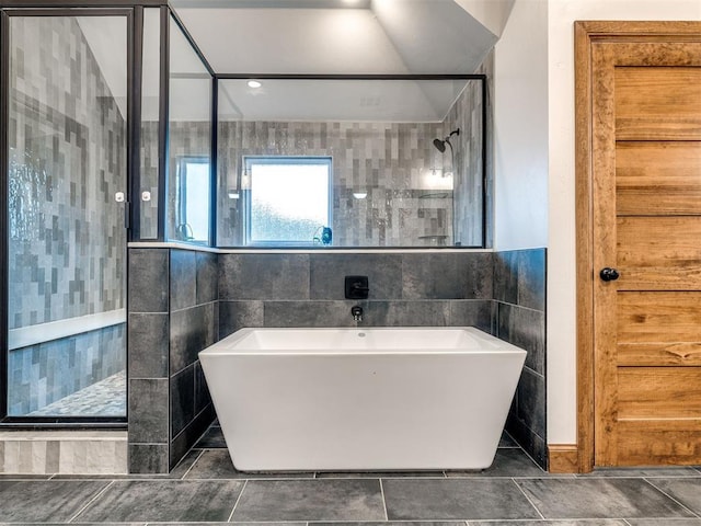 bathroom with plus walk in shower and tile walls