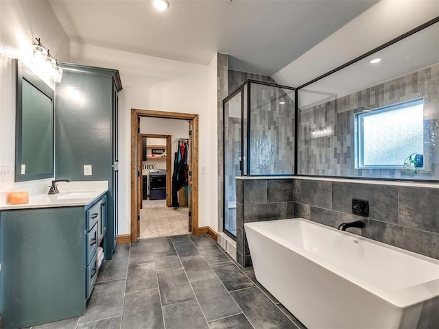 bathroom with vanity, tile patterned flooring, and shower with separate bathtub