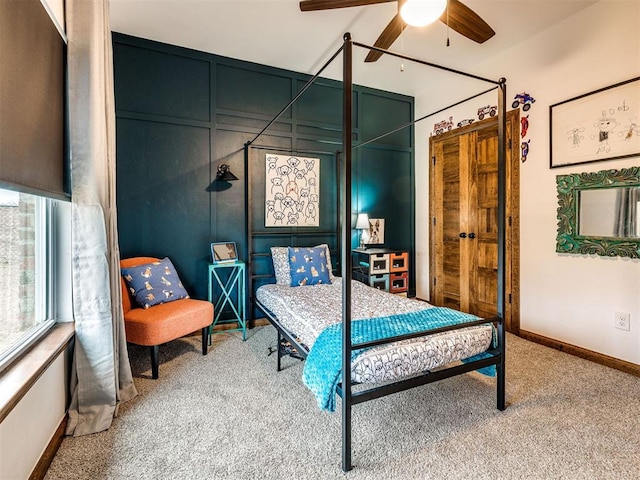 carpeted bedroom featuring ceiling fan